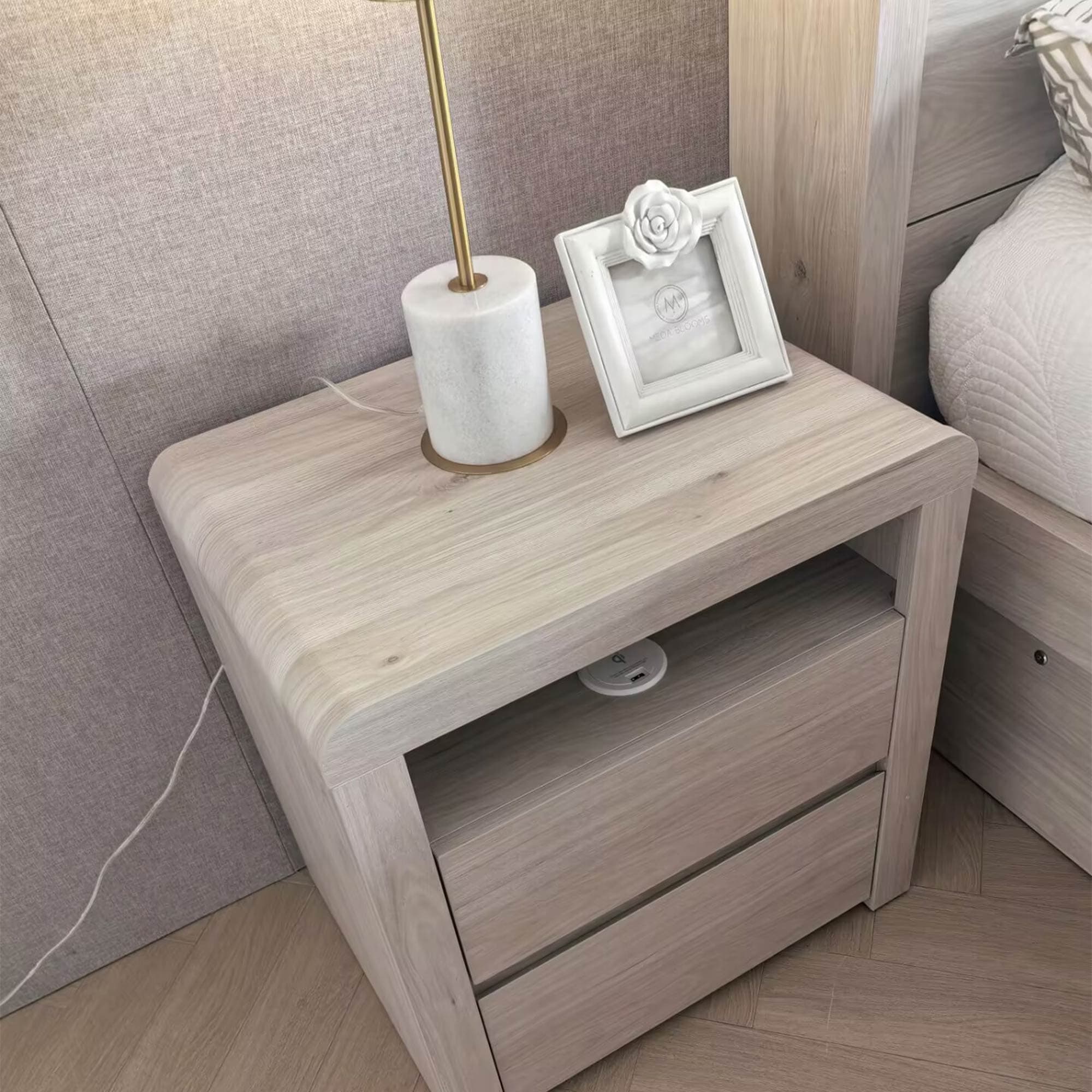 Lifestyle image of the Aria (Milan Oak) Bedside Table 2 Drawer W/Usb Charger from Forty Winks