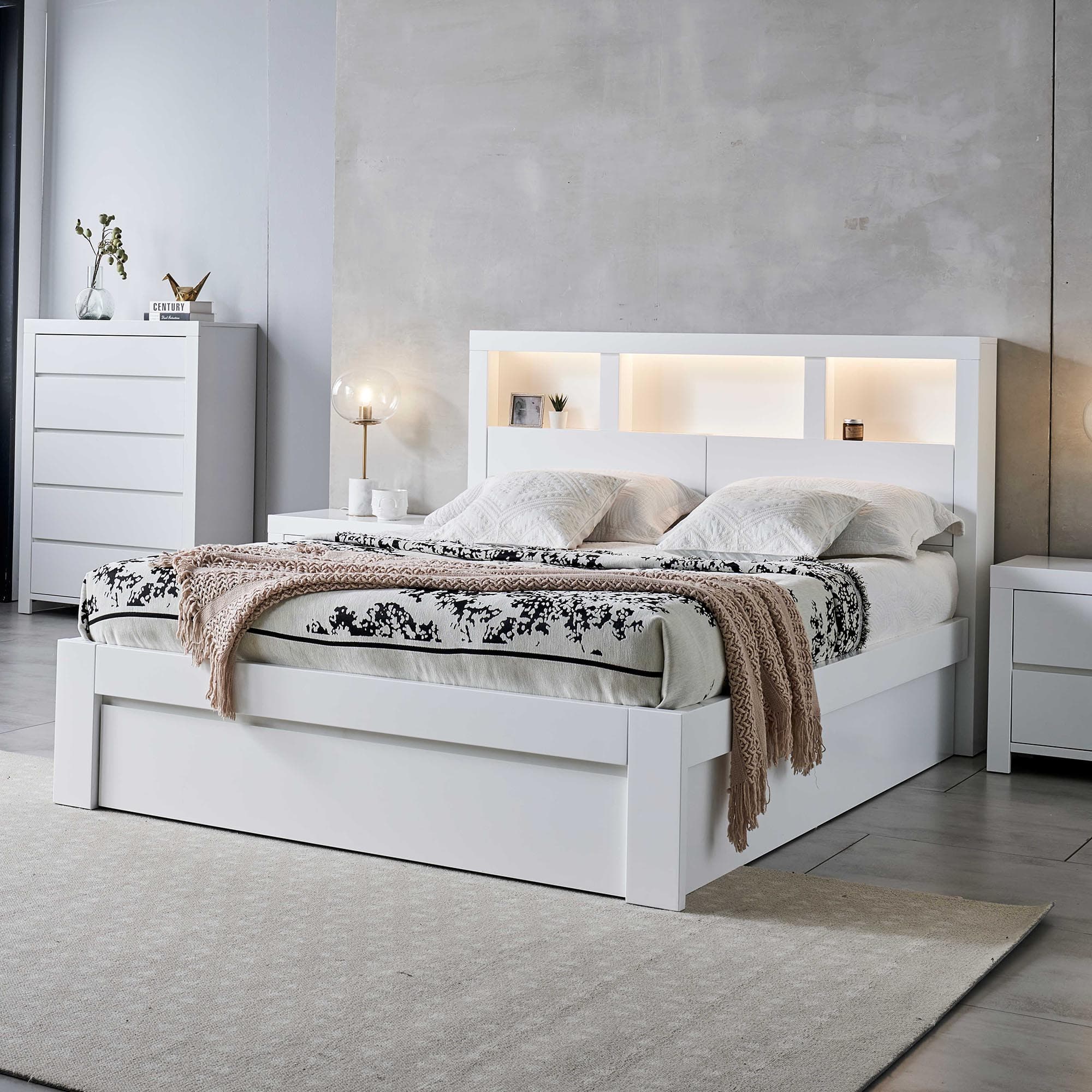 Lifestyle image of the  Lugano Ivory White Qb Bed W/Front Slat Gas Lift & End Drawer Base from Forty Winks