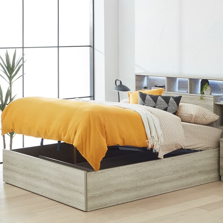 Lifestyle image of the  Argo Rustic Ash Qb Bed W/Gas Lift & End Drawer Base from Forty Winks