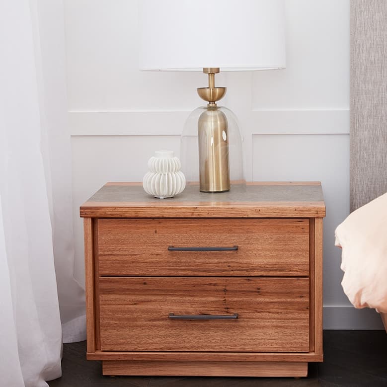 Lifestyle image of the  Alexa Bedside Table 2 Drawer W/Stone Top (Native) from Forty Winks