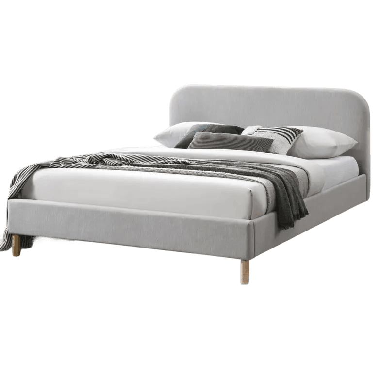 Upholstered bed base with layered linen styling