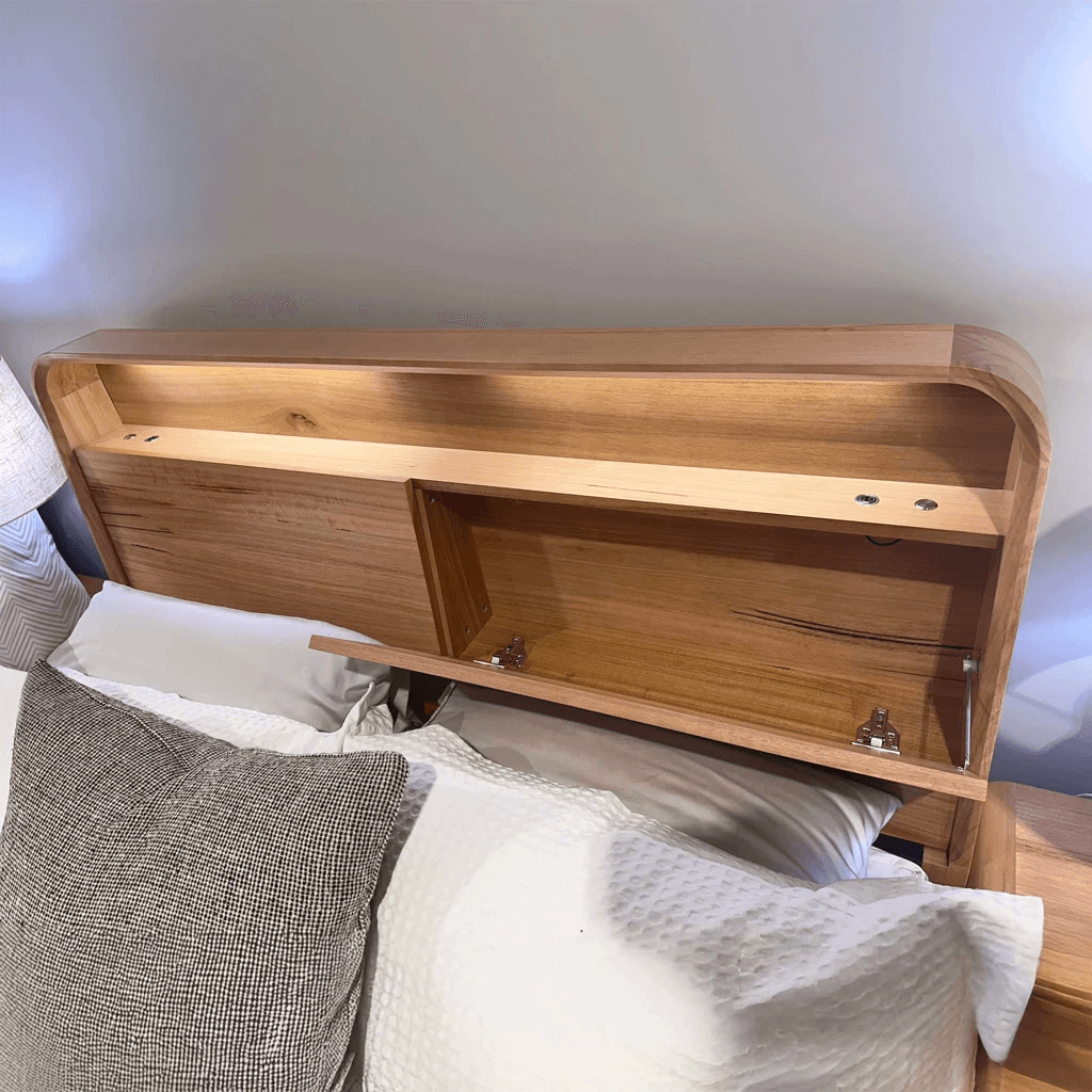 Close-up of the Valentine bedhead showing its timber grain and curved edge